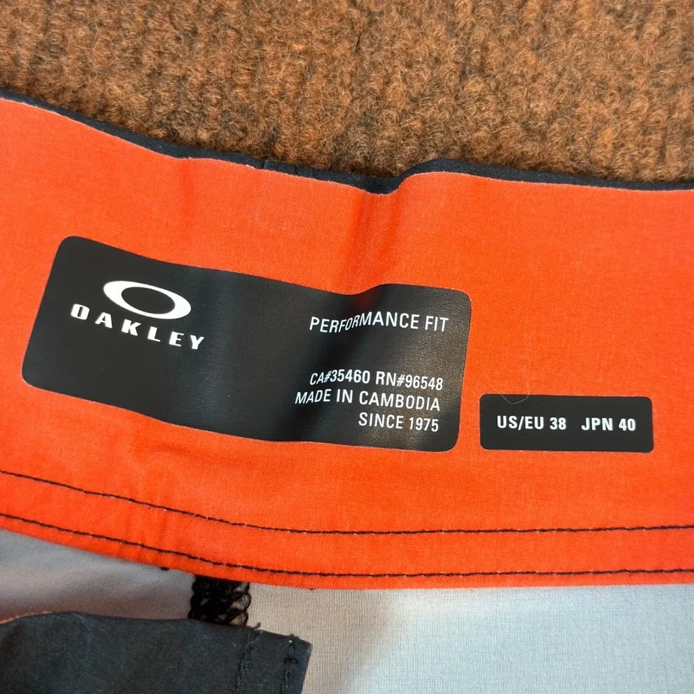 A+ Oakley Performance Fit Board Shorts Mens 38 Black Orange Ellipse Swim Trunks